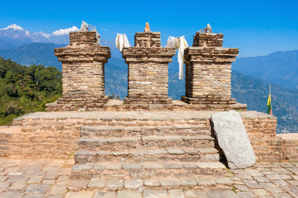 Historical structures with mountain backdrop